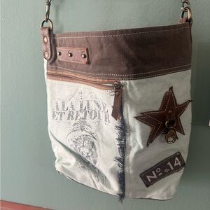 Rustic canvas & leather crossbody tote with star patch, lined & roomy